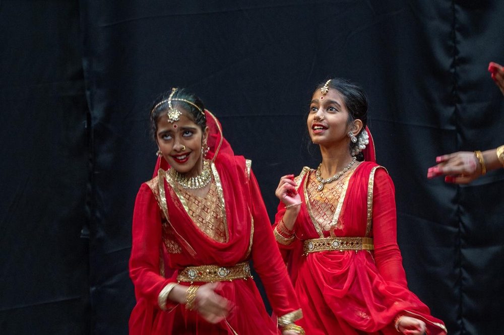 Two NrityaShrm students performing on stage